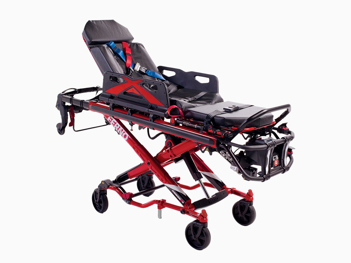 A Ferno POWER X2 powered ambulance cot with its backrest raised, seen three-quarter on a light ground.